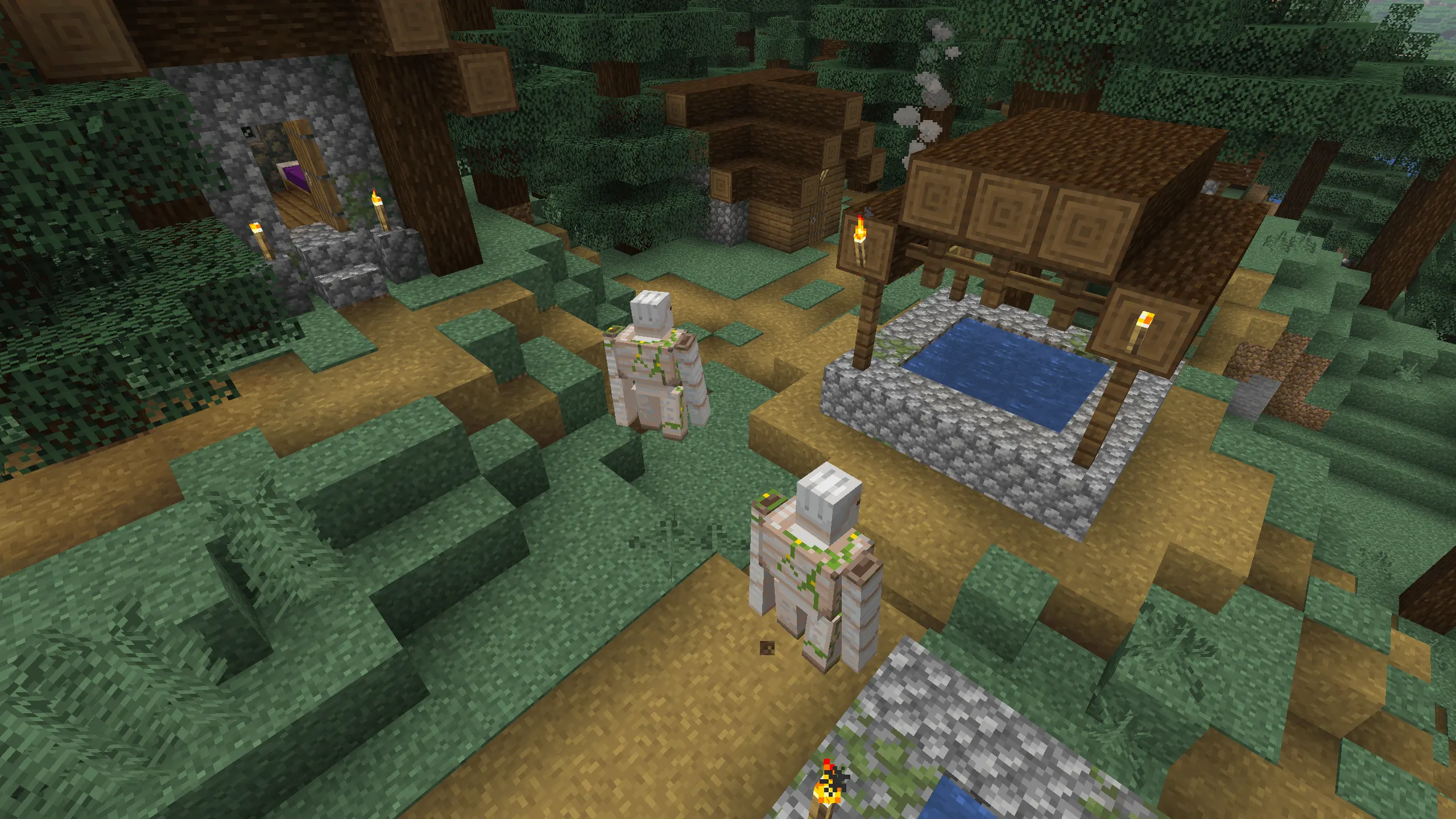 An overhead Minecraft screenshot of two Iron Golems patrolling a dirt path in a Taiga village. The village features dark spruce wood houses and a central cobblestone well with a wooden roof. Dense spruce trees and mossy grass surrounding the settlement emphasize the rugged, forest environment.