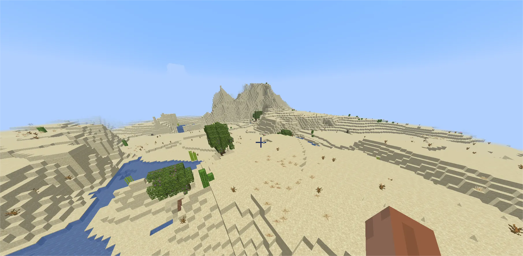 Minecraft desert biome with sandstone pyramid temple rising from sand dunes