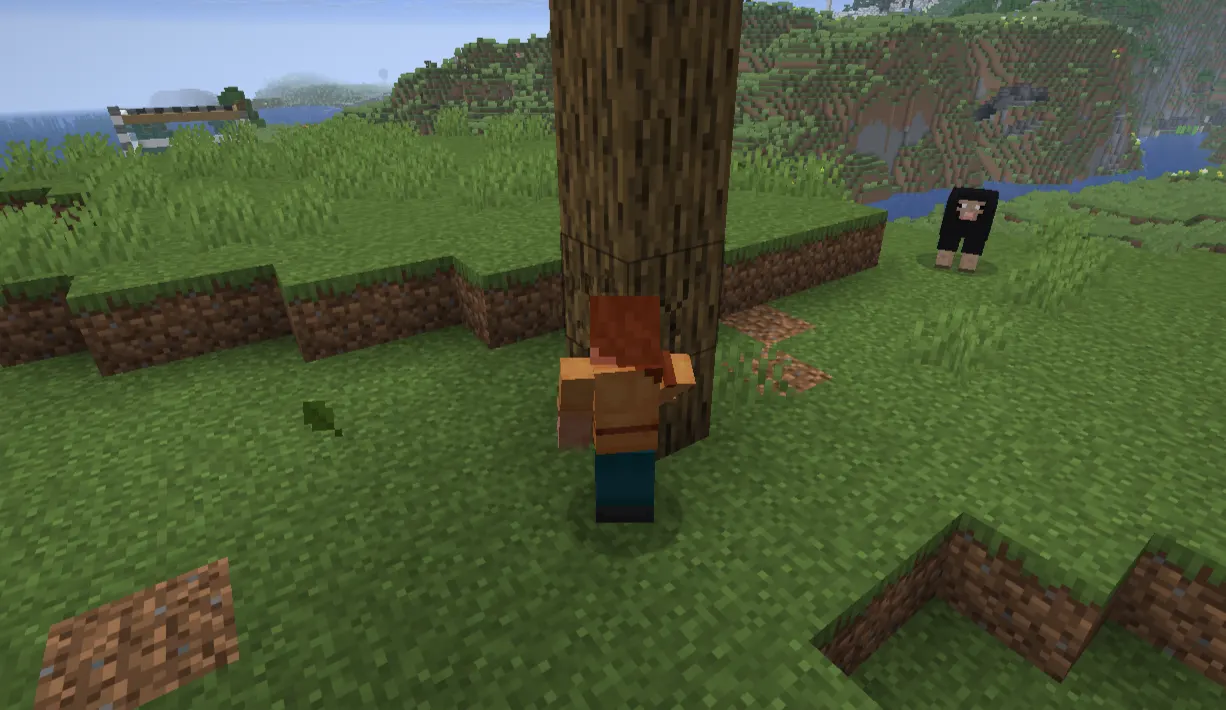  player punching a tree on the first day of Minecraft survival