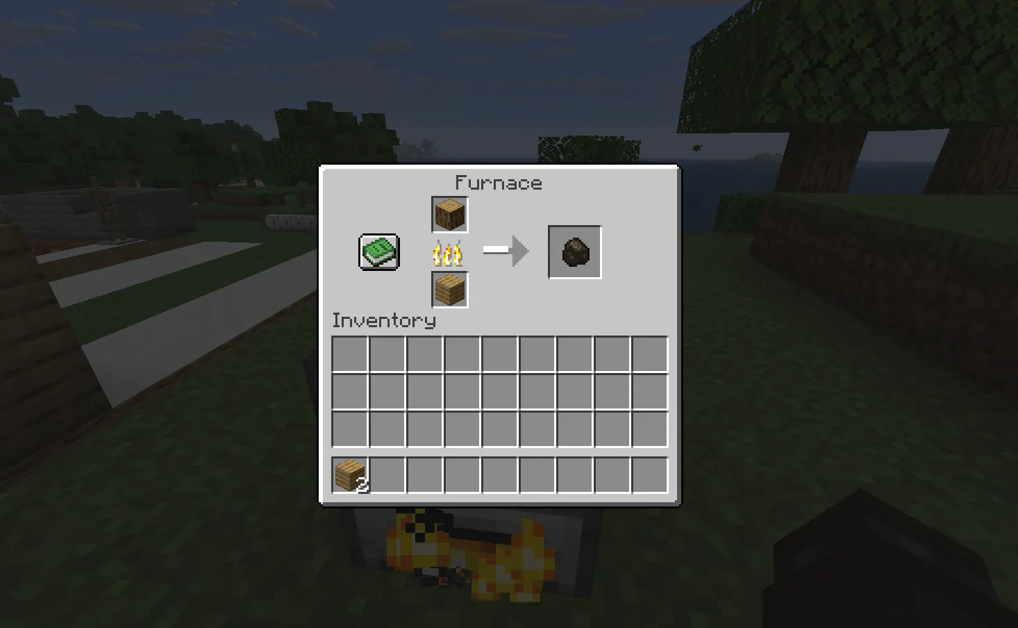 Smelting wood logs into charcoal in furnace Minecraft