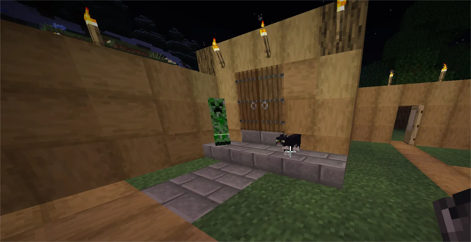 Cat and iron golem are protecting the Minecraft base from hostile mobs