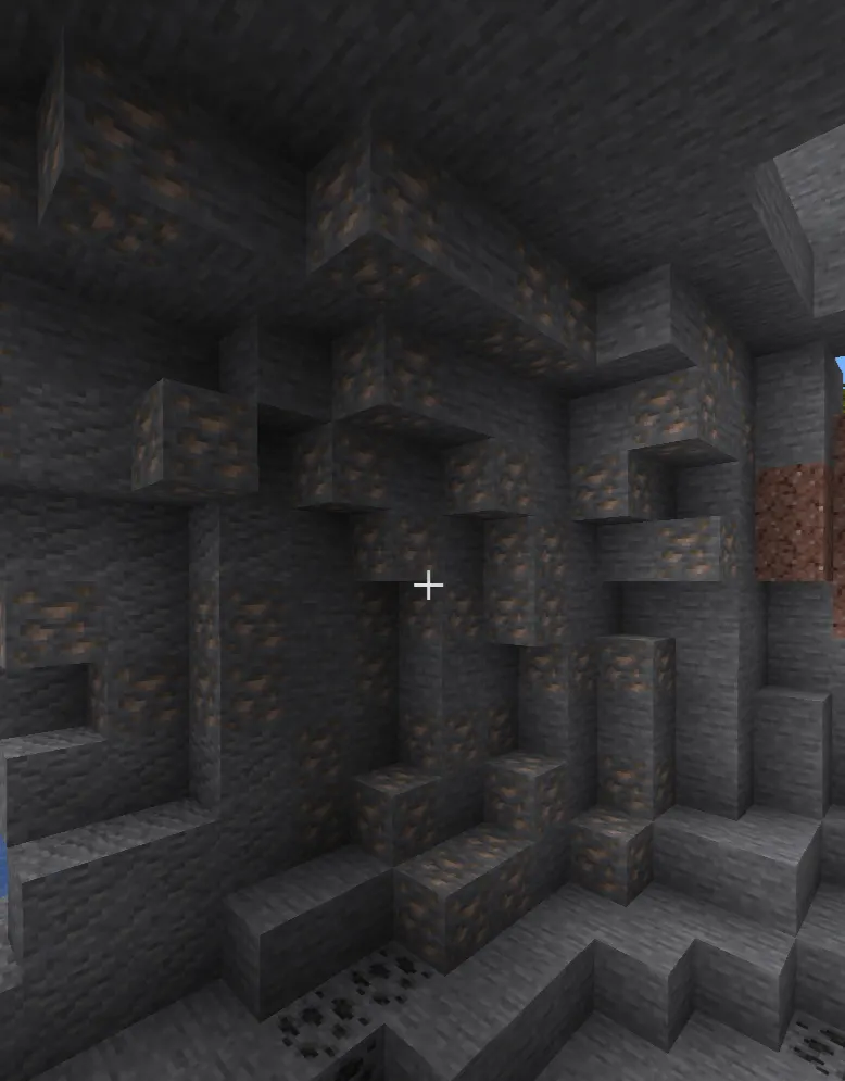 A large iron ore vein surrounded by tuff blocks in Minecraft