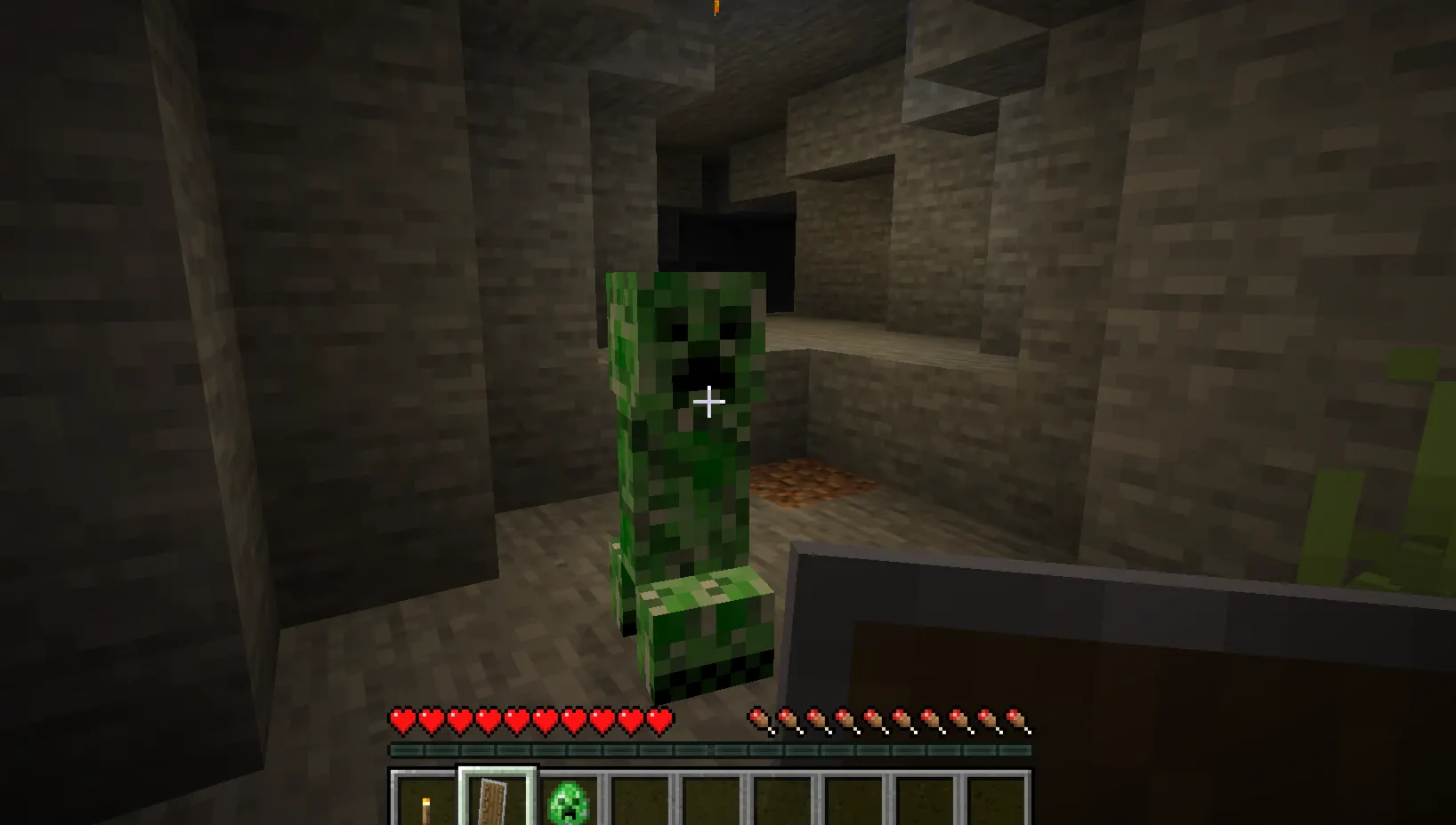 Player using a shield to survive a creeper explosion in Minecraft