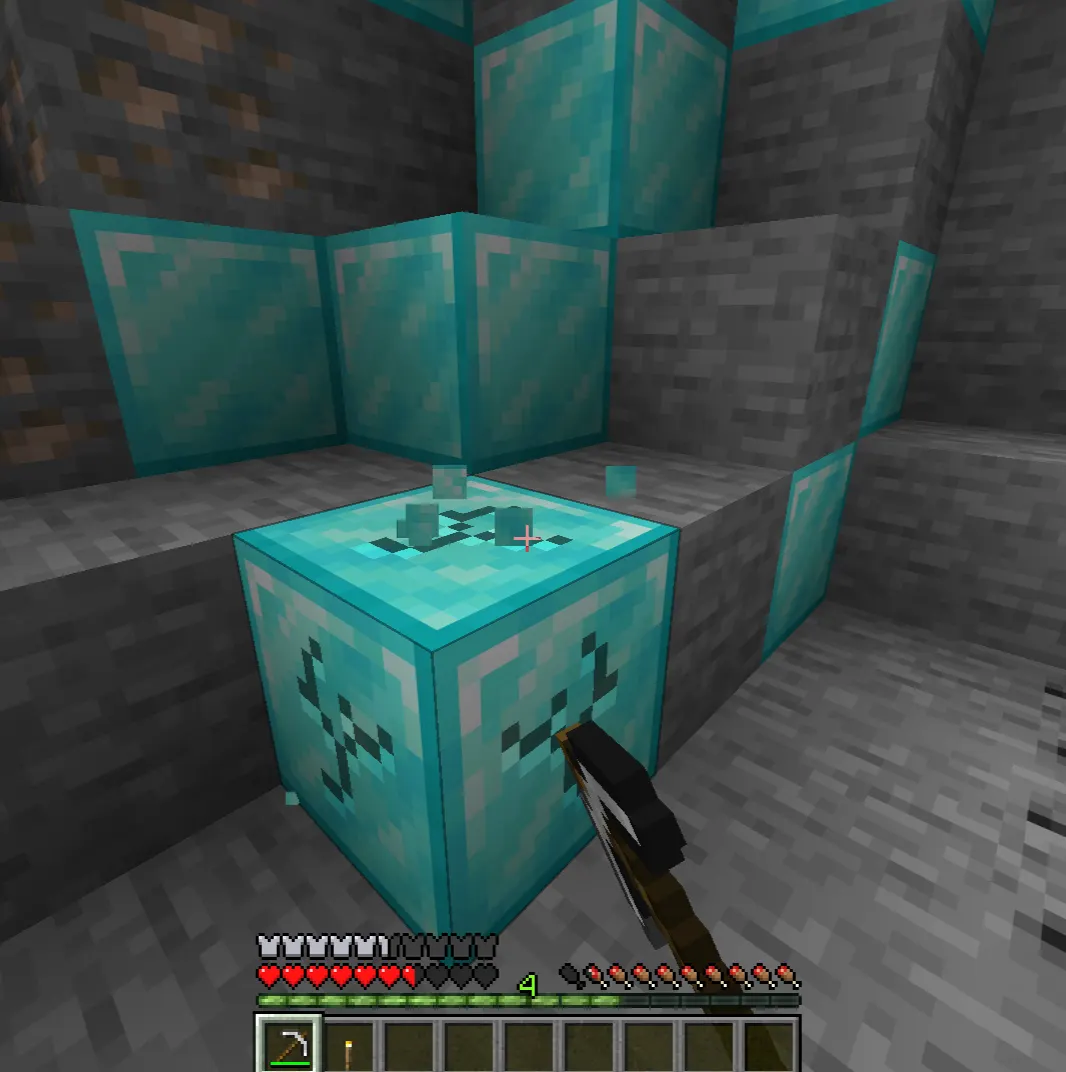Iron pickaxe mining diamond ore in Minecraft