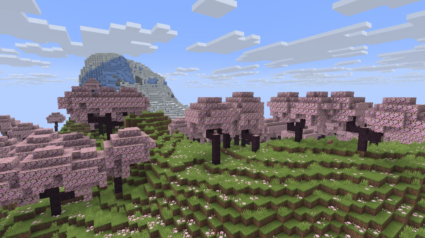 Cherry Grove biome in Minecraft showing pink cherry trees on a mountainside