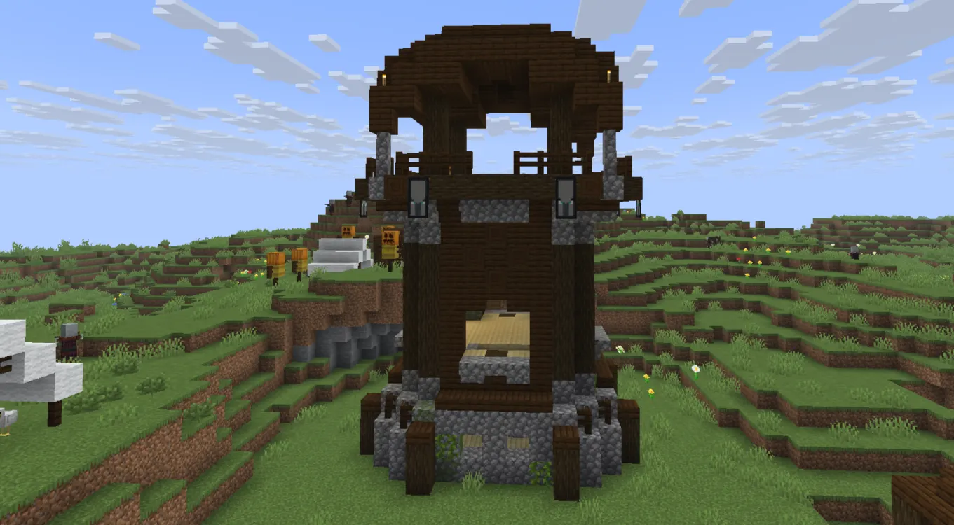  Pillager Outpost tower with a crossbow-wielding pillager standing in an open Plains biome