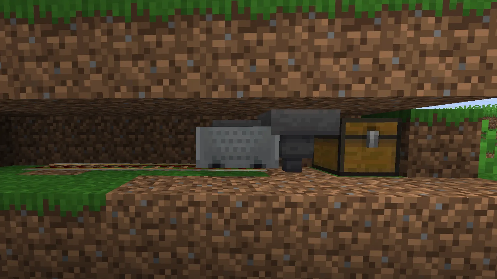 Hopper minecart collection system underneath an automatic wheat farm in Minecraft